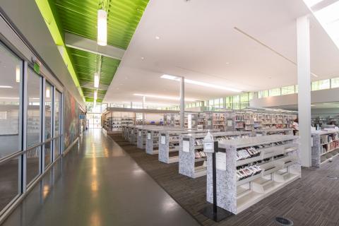 wide view of Anacostia main room with rows of book shelves