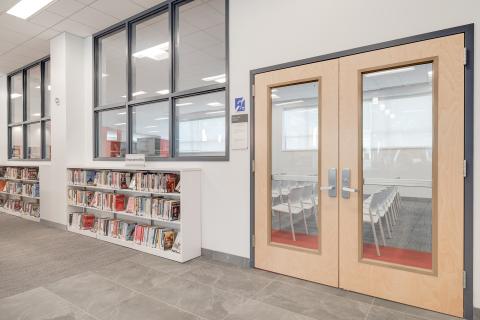double doors next to two bookshelves