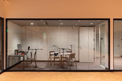 music and podcast recording studio with a wall of windows