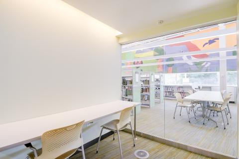 meeting room with two chairs at a desk