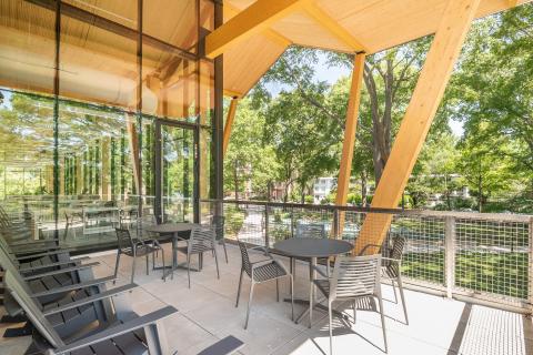 outdoor patio with two four-person tables