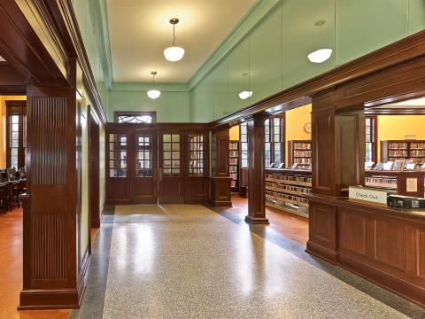 hallway that ends in two sets of double doors
