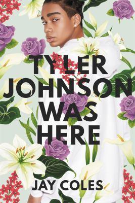 Cover of Tyler Johnson Was Here, a young man in a white hoodie surrounded by flowers, looking back at the viewer