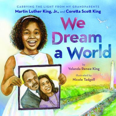Cover of a young girl holding a portrait of Martin LutherKing Jr. and Coretta Scott King