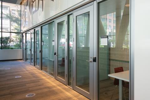 Hallway of meeting rooms with glass doors