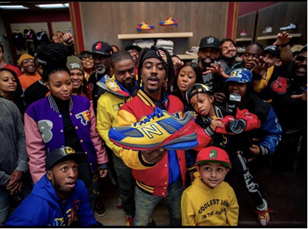 A group of men wearing Eat brand clothes, colorful sweatshirts and tshirts