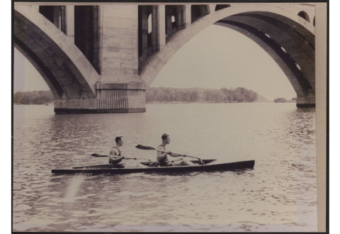black and white image of two men in a boat on the Potomac River