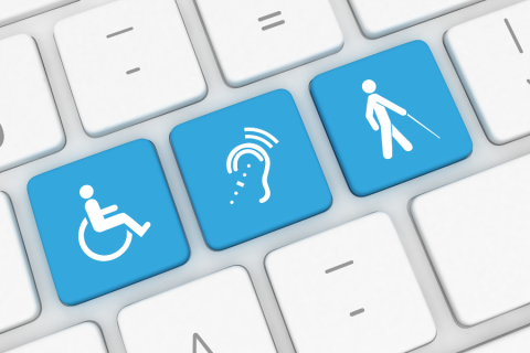closeup of three computer keys displaying accessibility icons